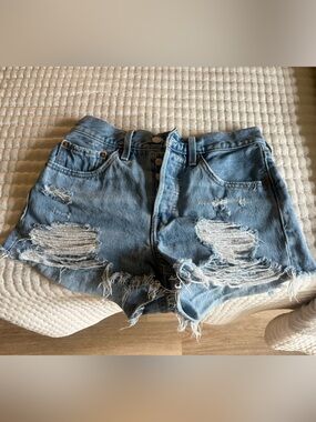 distressed Levi’s jean shorts
